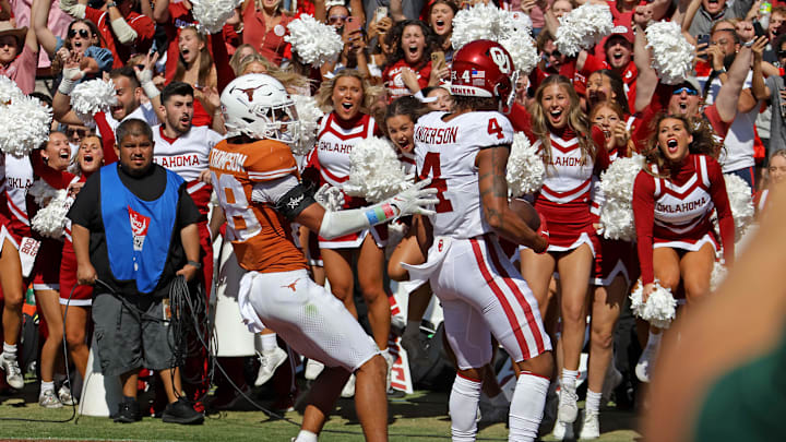 Oklahoma Sooners wide receiver Nic Anderson (4) celebrates a touchdown beside Texas Longhorns defensive back Jerrin Thompson (28) late in the fourth quarter during the Red River Rivalry college football game between the University of Oklahoma Sooners (OU) and the University of Texas (UT) Longhorns at the Cotton Bowl in Dallas, Saturday, Oct. 7, 2023. Oklahoma won 34-30.