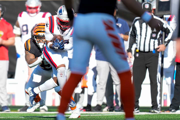 New England Patriots cornerback Marcus Jones (25) intercepts a pass intended for Cincinnati Bengals running back Tahj Brooks New England Patriots cornerback Marcus Jones (25) intercepts a pass intended for Cincinnati Bengals running back Tahj Brooks