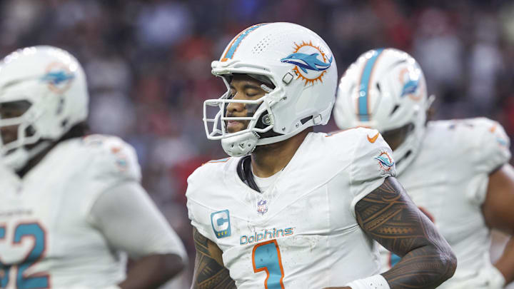 Dec 15, 2024; Houston, Texas, USA; Miami Dolphins quarterback Tua Tagovailoa (1) jogs off the field after a play during the fourth quarter against the Houston Texans at NRG Stadium. 