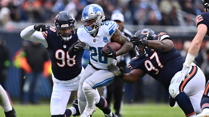 Dec 10, 2023; Chicago, Illinois, USA; Detroit Lions running back Jahmyr Gibbs (26) picks up yardage before being tackled by Chicago Bears defensive lineman Montez Sweat (98) and defensive lineman Andrew Billings (97) in the first half at Soldier Field. Mandatory Credit: Jamie Sabau-Imagn Images Dec 10, 2023; Chicago, Illinois, USA; Detroit Lions running back Jahmyr Gibbs (26) picks up yardage before being tackled by Chicago Bears defensive lineman Montez Sweat (98) and defensive lineman Andrew Billings (97) in the first half at Soldier Field. Mandatory Credit: Jamie Sabau-Imagn Images