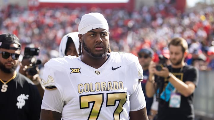 Oct 19, 2024; Tucson, Arizona, USA; Colorado Buffalos offensive tackle Jordan Seaton (77) against the Arizona Wildcats at Arizona Stadium. 