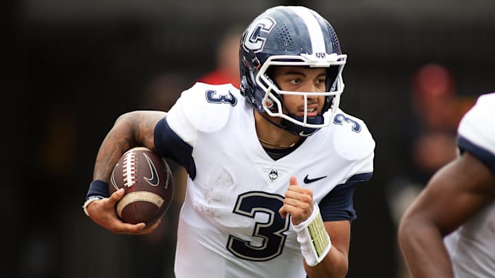 Aug 31, 2024; College Park, Maryland, USA; Connecticut Huskies quarterback Nick Evers (3) runs during the first quarter against the Maryland Terrapins at SECU Stadium. Mandatory Credit: Daniel Kucin Jr.-Imagn Images
