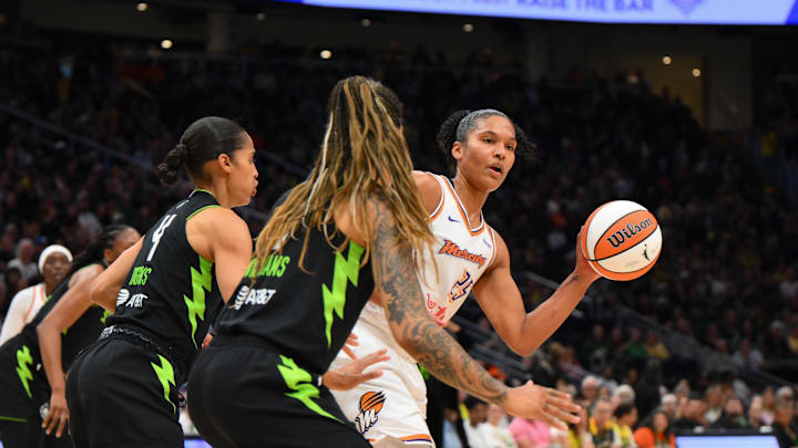 Aug 17, 2025; Seattle, Washington, USA; Phoenix Mercury forward Alyssa Thomas (25) passes the ball against the Seattle Storm during the first half at Climate Pledge Arena. Mandatory Credit: Steven Bisig-Imagn Images
