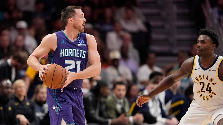 Charlotte Hornets guard Pat Connaughton (21) sets the play defended by Indiana Pacers forward Kobe Brown Charlotte Hornets guard Pat Connaughton (21) sets the play defended by Indiana Pacers forward Kobe Brown