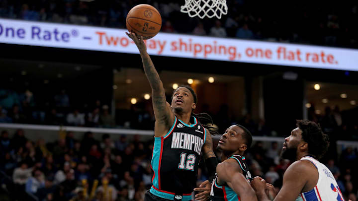 Dec 30, 2025; Memphis, Tennessee, USA; Memphis Grizzlies guard Ja Morant (12) shoots during the fourth quarter against the Philadelphia 76ers at FedExForum. Mandatory Credit: Petre Thomas-Imagn Images