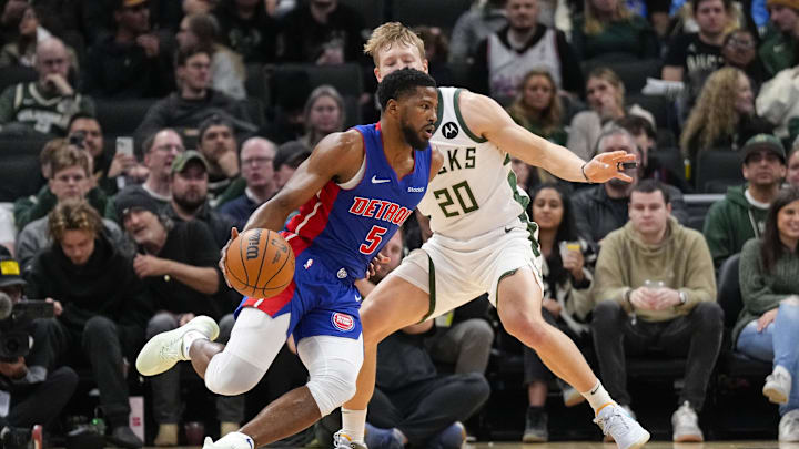 Nov 13, 2024; Milwaukee, Wisconsin, USA;  Detroit Pistons guard Malik Beasley (5) drives towards the basket against Milwaukee Bucks guard AJ Green (20) during the first quarter at Fiserv Forum. Mandatory Credit: Jeff Hanisch-Imagn Images