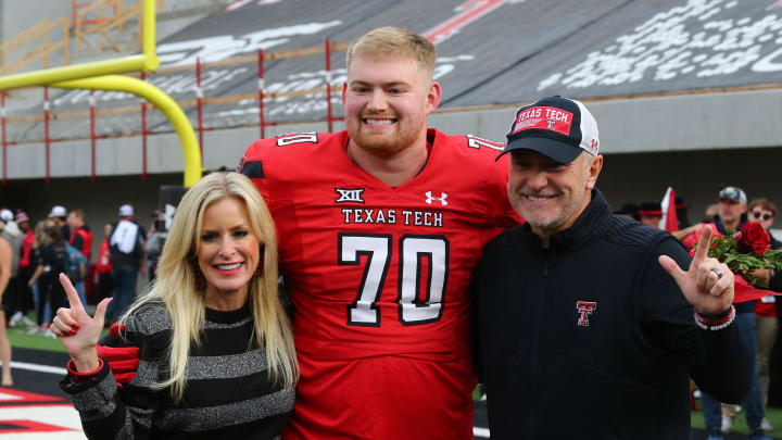 Nov 18, 2023; Lubbock, Texas, USA; Texas Tech Red Raiders senior offensive lineman Cole Spencer (70) with head coach Joey McGuire and wife Debbie before the game against the Central Florida Knights at Jones AT&T Stadium and Cody Campbell Field. Mandatory Credit: Michael C. Johnson-USA TODAY Sports Nov 18, 2023; Lubbock, Texas, USA; Texas Tech Red Raiders senior offensive lineman Cole Spencer (70) with head coach Joey McGuire and wife Debbie before the game against the Central Florida Knights at Jones AT&T Stadium and Cody Campbell Field. Mandatory Credit: Michael C. Johnson-USA TODAY Sports