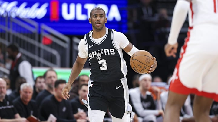 Nov 6, 2024; Houston, Texas, USA; San Antonio Spurs guard Chris Paul (3) brings the ball up the court during the first quarter against the Houston Rockets at Toyota Center. Mandatory Credit: Troy Taormina-Imagn Images