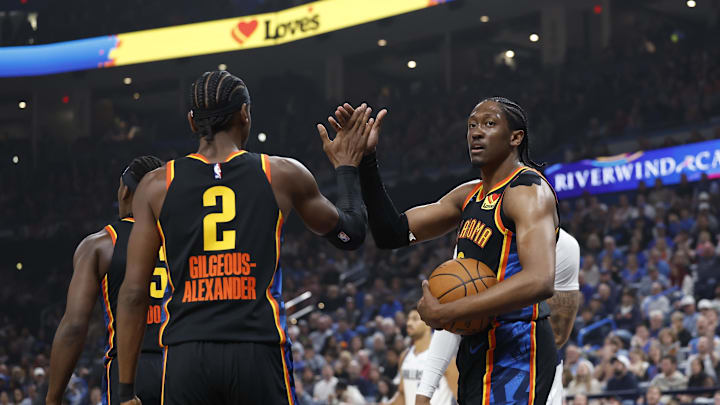 Nov 17, 2024; Oklahoma City, Oklahoma, USA; Oklahoma City Thunder guard Shai Gilgeous-Alexander (2) and forward Jalen Williams (8) high five after a play against the Dallas Mavericks during the first quarter at Paycom Center. Mandatory Credit: Alonzo Adams-Imagn Images