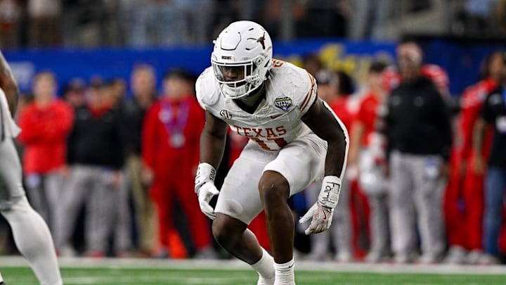 Jan 10, 2025; Arlington, TX, USA; Texas Longhorns linebacker Colin Simmons (11) in action during the game between the Texas Longhorns and the Ohio State Buckeyes at AT&T Stadium. Mandatory Credit: Jerome Miron-Imagn Images