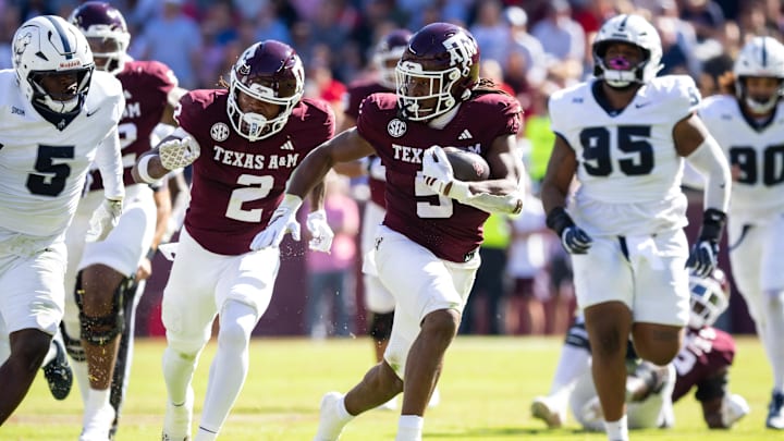 Nov 22, 2025; College Station, Texas, USA; Texas A&M Aggies running back Amari Daniels (5) runs with the ball in the first half of a game against the Samford Bulldogs at Kyle Field. Mandatory Credit: Joseph Buvid-Imagn Images Nov 22, 2025; College Station, Texas, USA; Texas A&M Aggies running back Amari Daniels (5) runs with the ball in the first half of a game against the Samford Bulldogs at Kyle Field. Mandatory Credit: Joseph Buvid-Imagn Images