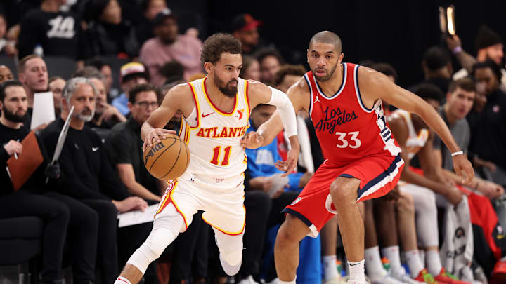 Jan 4, 2025; Inglewood, California, USA; Atlanta Hawks guard Trae Young (11) dribbles the ball against Los Angeles Clippers forward Nicolas Batum (33) during the second quarter at Intuit Dome. Mandatory Credit: Kiyoshi Mio-Imagn Images Jan 4, 2025; Inglewood, California, USA; Atlanta Hawks guard Trae Young (11) dribbles the ball against Los Angeles Clippers forward Nicolas Batum (33) during the second quarter at Intuit Dome. Mandatory Credit: Kiyoshi Mio-Imagn Images