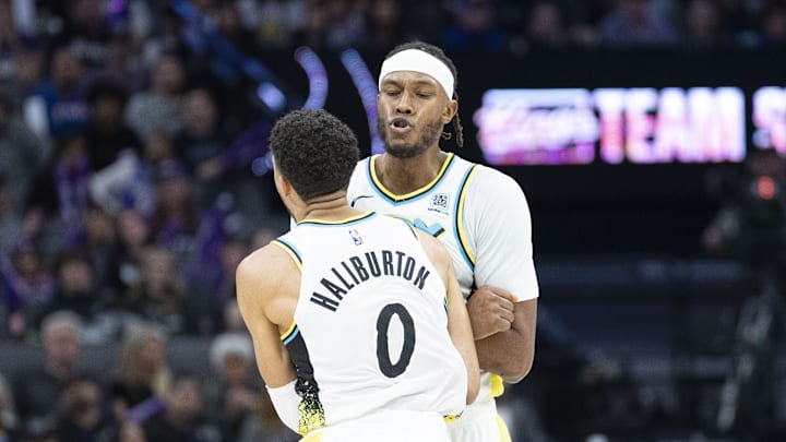 December 22, 2024; Sacramento, California, USA; Indiana Pacers center Myles Turner (33) celebrates with guard Tyrese Haliburton (0) against the Sacramento Kings during the third quarter at Golden 1 Center. Mandatory Credit: Kyle Terada-Imagn Images