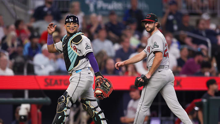 Jun 3, 2025; Atlanta, Georgia, USA; Arizona Diamondbacks catcher Gabriel Moreno (14) and starting pitcher Zac Gallen (23) react after an out against the Atlanta Braves in the seventh inning at Truist Park. Mandatory Credit: Brett Davis-Imagn Images Jun 3, 2025; Atlanta, Georgia, USA; Arizona Diamondbacks catcher Gabriel Moreno (14) and starting pitcher Zac Gallen (23) react after an out against the Atlanta Braves in the seventh inning at Truist Park. Mandatory Credit: Brett Davis-Imagn Images