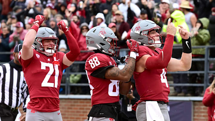 Oct 25, 2025; Pullman, Washington, USA; Washington State Cougars quarterback Zevi Eckhaus (4) celebrates after a touchdown against the Toledo Rockets in the first half at Gesa Field at Martin Stadium. Mandatory Credit: James Snook-Imagn Images