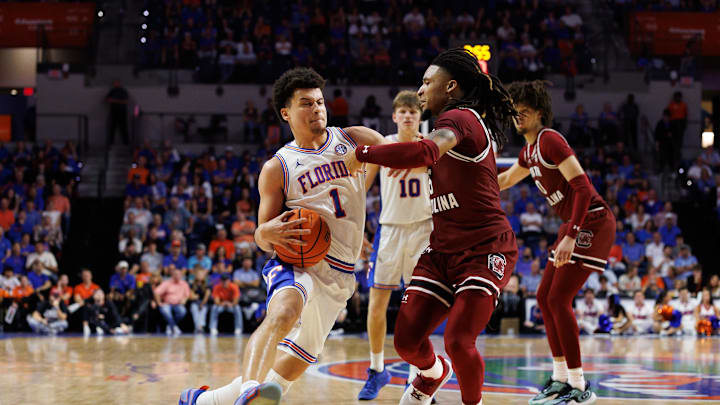 Feb 15, 2025; Gainesville, Florida, USA; Florida Gators guard Walter Clayton Jr. (1) drives to the basket against South Carolina Gamecocks guard Jamarii Thomas (6) during the second half at Exactech Arena at the Stephen C. O'Connell Center. Mandatory Credit: Matt Pendleton-Imagn Images