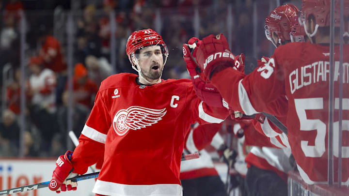 Jan 7, 2025; Detroit, Michigan, USA; Detroit Red Wings center Dylan Larkin (71) receives congratulations from teammates after scoring in the first period against the Ottawa Senators at Little Caesars Arena. Mandatory Credit: Rick Osentoski-Imagn Images