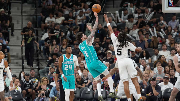 Charlotte Hornets guard LaMelo Ball (1) shoots over San Antonio Spurs guard Stephon Castle