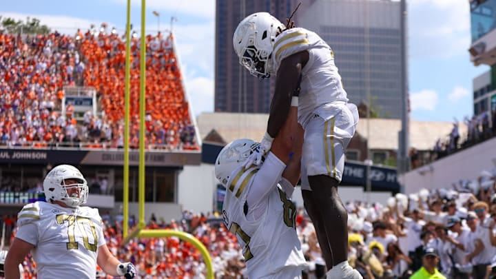 Sep 13, 2025; Atlanta, Georgia, USA; Georgia Tech Yellow Jackets running back Jamal Haynes (1) celebrates after a touchdown with offensive lineman Henry Peagler (60) against the Clemson Tigers in the second quarter at Bobby Dodd Stadium at Hyundai Field. Mandatory Credit: Brett Davis-Imagn Images