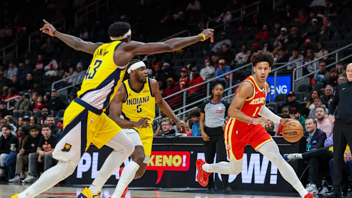 Jan 26, 2026; Atlanta, Georgia, USA; Atlanta Hawks forward Jalen Johnson (1) dribbles the ball towards the goal against Indiana Pacers forward Jarace Walker (5) and forward Pascal Siakam (43) during the first quarter at State Farm Arena. Mandatory Credit: Jordan Godfree-Imagn Images