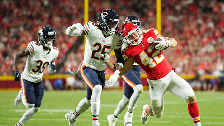 Aug 22, 2024; Kansas City, Missouri, USA; Kansas City Chiefs running back Carson Steele (42) runs the ball against Chicago Bears safety Adrian Colbert (25) during the first half at GEHA Field at Arrowhead Stadium. Mandatory Credit: Jay Biggerstaff-Imagn Images