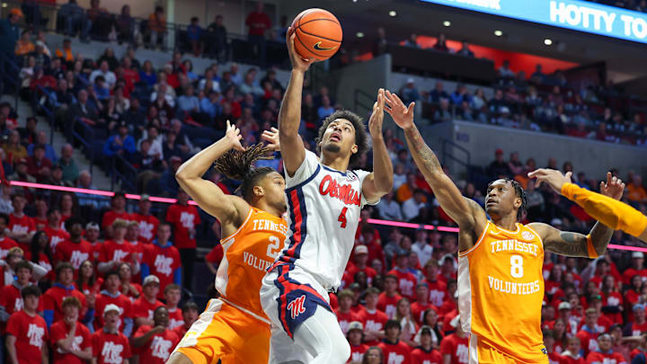 Mar 5, 2025; Oxford, Mississippi, USA; Mississippi Rebels forward Jaemyn Brakefield (4) shoots the ball against Tennessee Volunteers guard Darlinstone Dunbar (8) during the second half at The Sandy and John Black Pavilion at Ole Miss. Mandatory Credit: Wesley Hale-Imagn Images Mar 5, 2025; Oxford, Mississippi, USA; Mississippi Rebels forward Jaemyn Brakefield (4) shoots the ball against Tennessee Volunteers guard Darlinstone Dunbar (8) during the second half at The Sandy and John Black Pavilion at Ole Miss. Mandatory Credit: Wesley Hale-Imagn Images