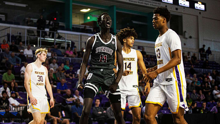 John Bol from Sunrise Christian Academy celebrates a dunk plus one during the GEICO High School