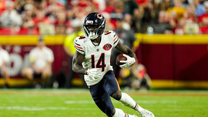 Aug 22, 2025; Kansas City, Missouri, USA; Chicago Bears wide receiver Olamide Zaccheaus (14) runs with the ball during the first half against the Kansas City Chiefs at GEHA Field at Arrowhead Stadium. Mandatory Credit: Jay Biggerstaff-Imagn Images