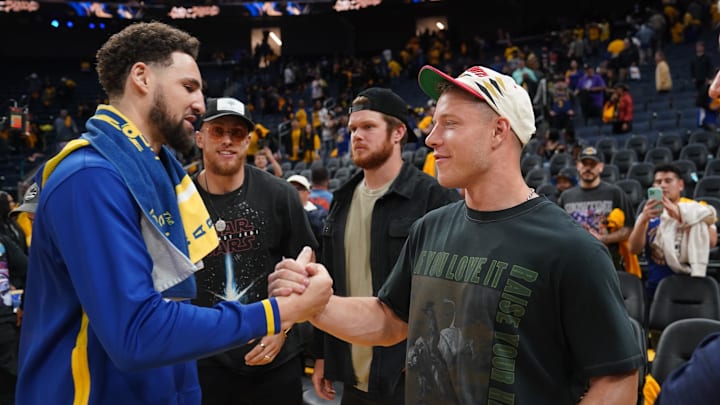 Golden State Warriors guard Klay Thompson (L) meets San Francisco 49ers running back Christian McCaffrey (R)