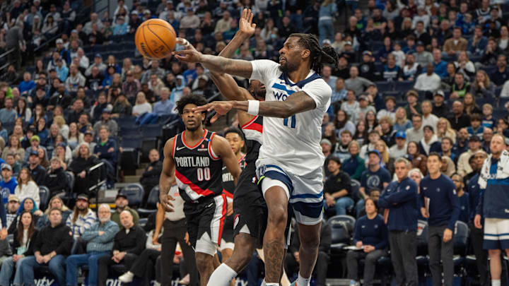 Feb 8, 2025; Minneapolis, Minnesota, USA; Minnesota Timberwolves center Naz Reid (11) passes against the Portland Trail Blazers in the fourth quarter at Target Center.