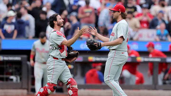 May 14, 2024; New York City, New York, USA; Philadelphia Phillies catcher Garrett Stubbs (21) shakes hands with starting pitcher Aaron Nola (27) after defeating the New York Mets at Citi Field. Mandatory Credit: Brad Penner-USA TODAY Sports