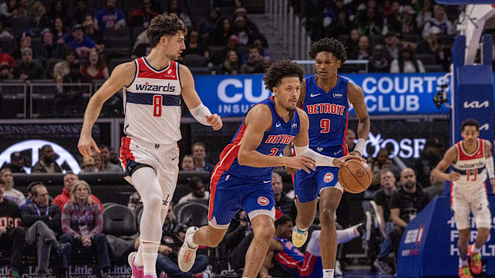 Nov 27, 2023; Detroit, Michigan, USA; Detroit Pistons guard Cade Cunningham (2) moves the ball up