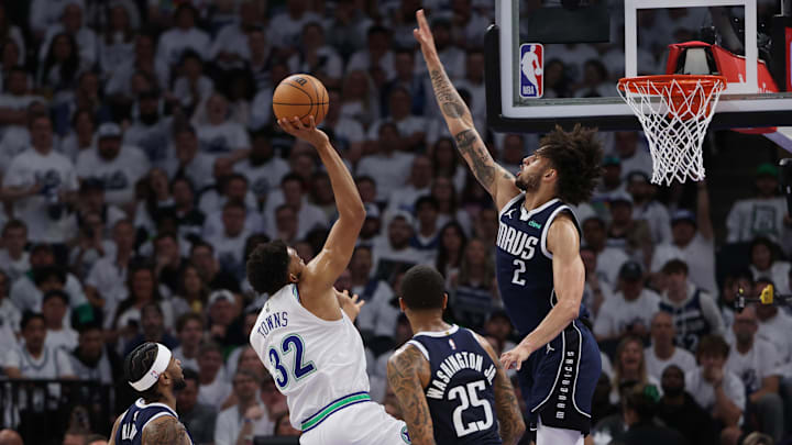 May 22, 2024; Minneapolis, Minnesota, USA; Minnesota Timberwolves center Karl-Anthony Towns shoots against Dallas Mavericks center Dereck Lively II