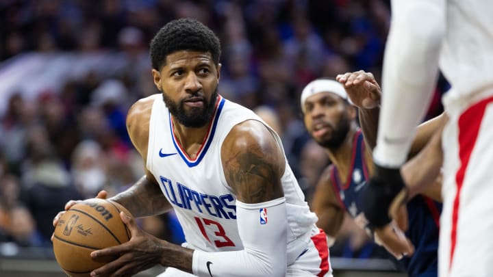Mar 27, 2024; Philadelphia, Pennsylvania, USA; LA Clippers forward Paul George (13) controls the ball Philadelphia 76ers during the fourth quarter at Wells Fargo Center. Mandatory Credit: Bill Streicher-USA TODAY Sports