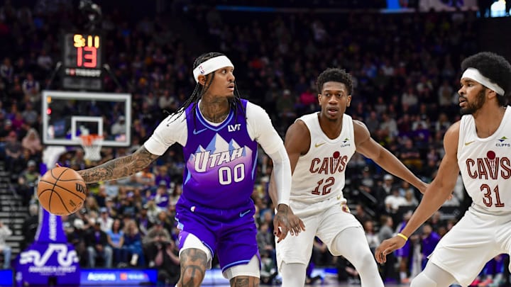Utah Jazz guard Jordan Clarkson looks to pass against Cleveland Cavaliers forward/guard De'Andre Hunter. Mandatory Credit: Peter Creveling-Imagn Images