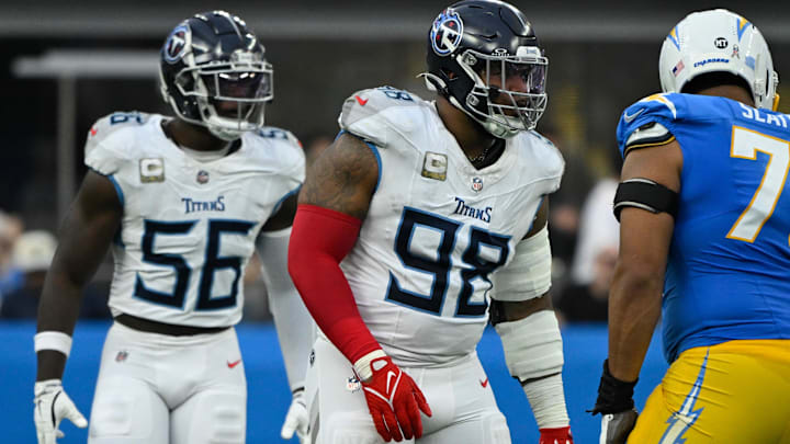 Nov 10, 2024; Inglewood, California, USA;  Tennessee Titans defensive tackle Jeffery Simmons (98) and  linebacker Kenneth Murray Jr. (56) during the third quarter against the Los Angeles Chargers at SoFi Stadium. Mandatory Credit: Robert Hanashiro-Imagn Images