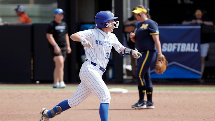 Kentucky catcher Grace Lorsung (33) celebrates after hitting a home run in the fourth inning of a softball game against Michigan in the first round of the Stillwater Regional of the NCAA Tournament in Stillwater, Okla., Friday, May 17, 2024.