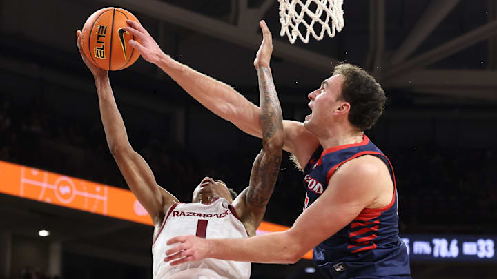 Samford forward Dylan Faulkner blocks Arkansas forward Meleek Thomas in a loss on Nov. 14.