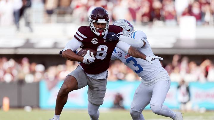 Mississippi State Bulldogs tight end Seydou Traore (8) runs against Mississippi Rebels safety Sage Ryan (3) in the second half at Davis Wade Stadium at Scott Field in the 2025 season.