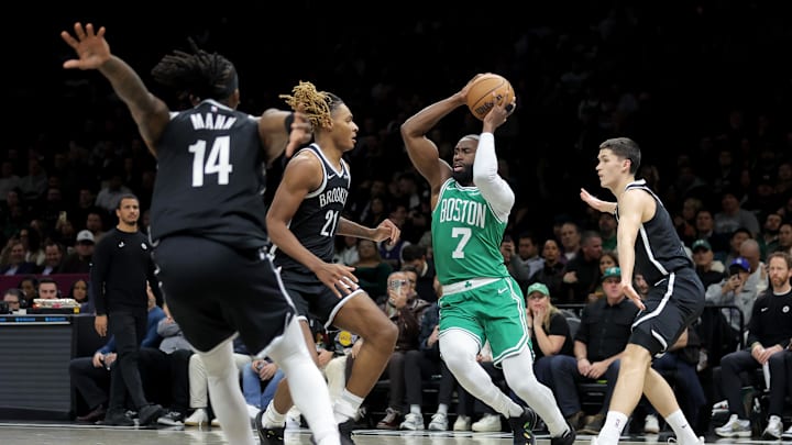 Nov 18, 2025; Brooklyn, New York, USA; Boston Celtics guard Jaylen Brown (7) looks to pass the ball against Brooklyn Nets forward Noah Clowney (21) and guards Terance Mann (14) and Egor Demin (8) during the first quarter at Barclays Center. Mandatory Credit: Brad Penner-Imagn Images Nov 18, 2025; Brooklyn, New York, USA; Boston Celtics guard Jaylen Brown (7) looks to pass the ball against Brooklyn Nets forward Noah Clowney (21) and guards Terance Mann (14) and Egor Demin (8) during the first quarter at Barclays Center. Mandatory Credit: Brad Penner-Imagn Images
