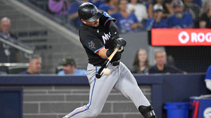 Sep 28, 2024; Toronto, Ontario, CAN; Miami Marlins first baseman Jake Burger (36) hits a single against the Toronto Blue Jays in the sixth inning at Rogers Centre. Mandatory Credit: Dan Hamilton-Imagn Images