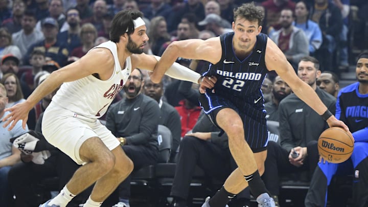 Mar 16, 2025; Cleveland, Ohio, USA; Cleveland Cavaliers guard Max Strus (1) defends Orlando Magic forward Franz Wagner (22) in the first quarter at Rocket Arena. Mandatory Credit: David Richard-Imagn Images