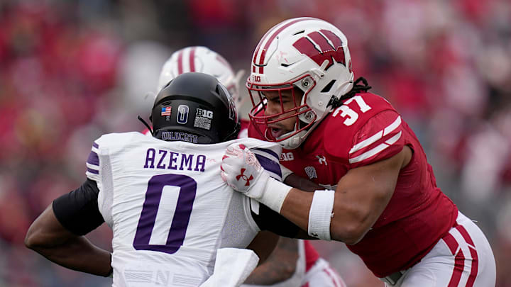 Wisconsin tight end Riley Nowakowski (37) blocks Northwestern defensive back Coco Azema (0) during the first quarter of their game Saturday, November 11, 2023 at Camp Randall Stadium in Madison, Wisconsin.