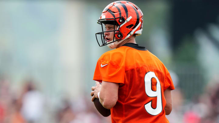 Jul 27, 2023; Cincinnati, Ohio, USA; Cincinnati Bengals quarterback Joe Burrow (9) drops back to pass during training camp practice at the practice fields beside Paycor Stadium. Mandatory Credit: Kareem Elgazzar/The Cincinnati Enquirer-USA TODAY Sports Jul 27, 2023; Cincinnati, Ohio, USA; Cincinnati Bengals quarterback Joe Burrow (9) drops back to pass during training camp practice at the practice fields beside Paycor Stadium. Mandatory Credit: Kareem Elgazzar/The Cincinnati Enquirer-USA TODAY Sports