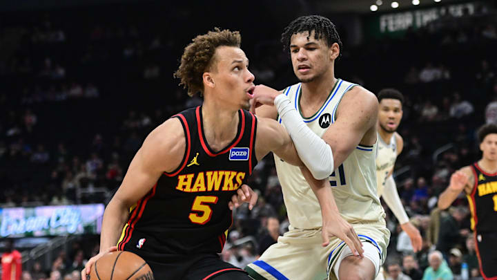 Mar 4, 2026; Milwaukee, Wisconsin, USA; Atlanta Hawks guard Dyson Daniels (5) drives for the basket against Milwaukee Bucks forward Ousmane Dieng (21) in the third quarter at Fiserv Forum. Mandatory Credit: Benny Sieu-Imagn Images