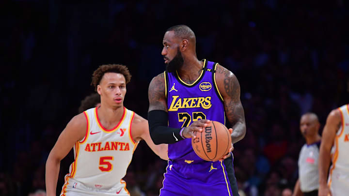 Jan 3, 2025; Los Angeles, California, USA; Los Angeles Lakers forward LeBron James (23) controls the ball against Atlanta Hawks guard Dyson Daniels (5) during the first half at Crypto.com Arena. Mandatory Credit: Gary A. Vasquez-Imagn Images Jan 3, 2025; Los Angeles, California, USA; Los Angeles Lakers forward LeBron James (23) controls the ball against Atlanta Hawks guard Dyson Daniels (5) during the first half at Crypto.com Arena. Mandatory Credit: Gary A. Vasquez-Imagn Images