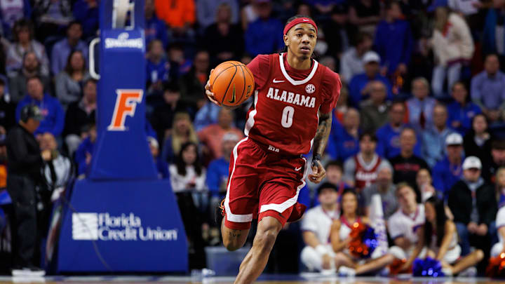 Feb 1, 2026; Gainesville, Florida, USA; Alabama Crimson Tide guard Labaron Philon (0) dribbles the ball against the Florida Gators during the first half at Exactech Arena at the Stephen C. O'Connell Center. Mandatory Credit: Matt Pendleton-Imagn Images
