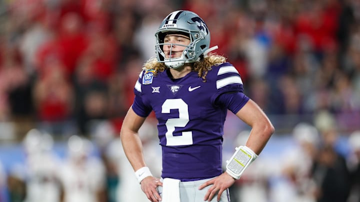 Dec 28, 2023; Orlando, FL, USA;  Kansas State Wildcats quarterback Avery Johnson (2) waits for a play call against the North Carolina State Wolfpack in the first quarter during the Pop-Tarts bowl at Camping World Stadium. Mandatory Credit: Nathan Ray Seebeck-USA TODAY Sports