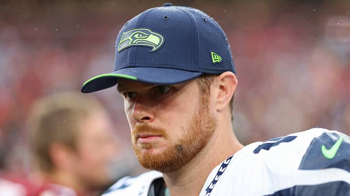 Seattle Seahawks quarterback Sam Darnold stands on the field