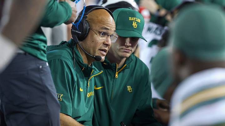 Nov 23, 2024; Houston, Texas, USA; Baylor Bears head coach Dave Aranda talks with players on the bench during the fourth quarter against the Houston Cougars at TDECU Stadium. Mandatory Credit: Troy Taormina Nov 23, 2024; Houston, Texas, USA; Baylor Bears head coach Dave Aranda talks with players on the bench during the fourth quarter against the Houston Cougars at TDECU Stadium. Mandatory Credit: Troy Taormina
